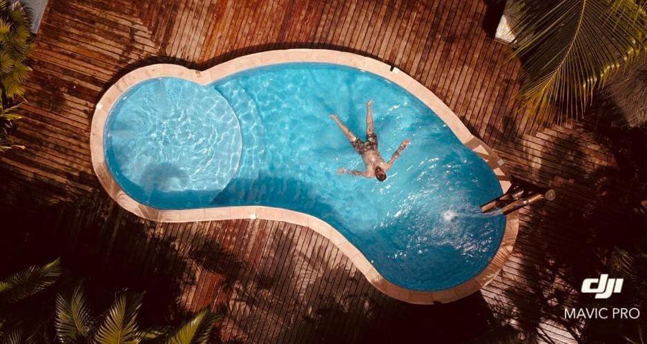 an overhead view of a man in a swimming pool at Pousada Villa Mares in Barra Grande