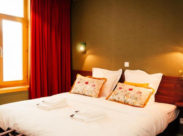 Postel nebo postele na pokoji v ubytování Gran Hotel De Passage