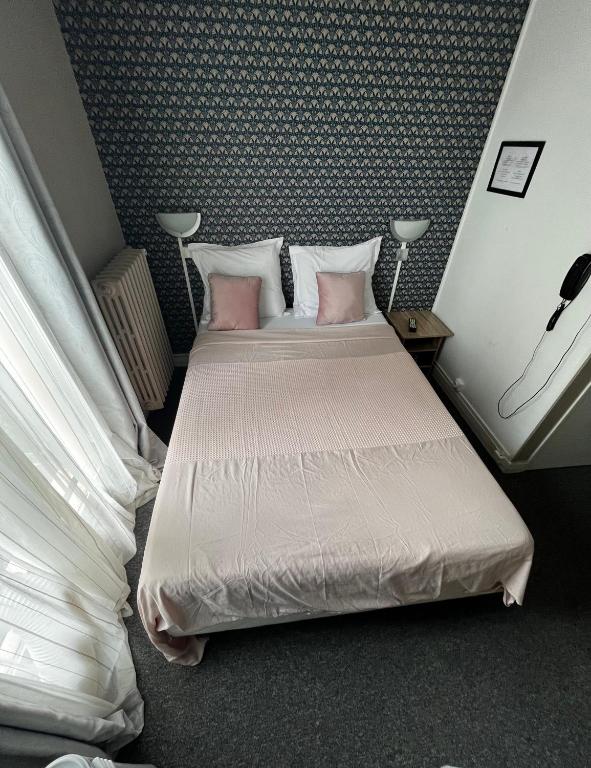 Postel nebo postele na pokoji v ubytování Hôtel Marie Louise