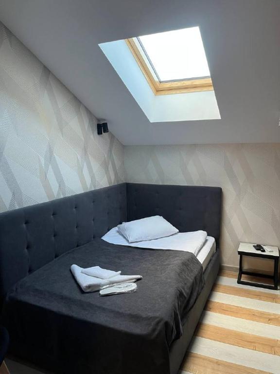 Postel nebo postele na pokoji v ubytování Forsage Hotel