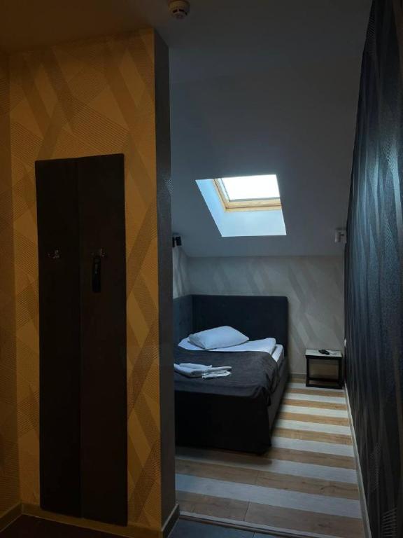 Postel nebo postele na pokoji v ubytování Forsage Hotel