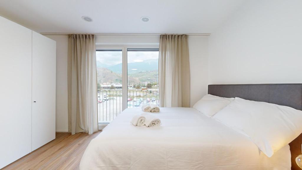 Postel nebo postele na pokoji v ubytování Bright & modern apartments in Sion