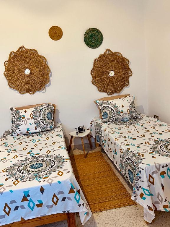 Postel nebo postele na pokoji v ubytování Appartement Vue de Mer Pied dans l'eau