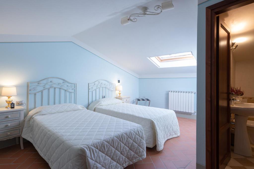 Postel nebo postele na pokoji v ubytování Villa Gerini