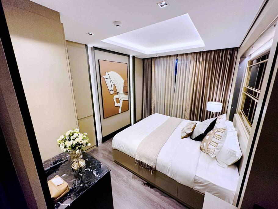 Postel nebo postele na pokoji v ubytování Erawan Luxury 2B2B Condo (2卧室豪华公寓古城中心)