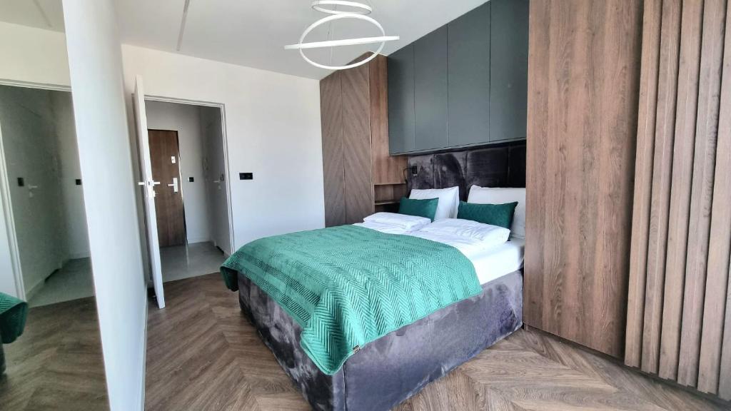 Posteľ alebo postele v izbe v ubytovaní NOOK NOOK Apartments Bytkowska 103