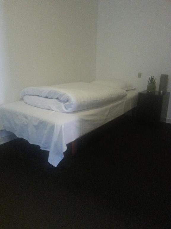 Postel nebo postele na pokoji v ubytování Centrum Sleepover