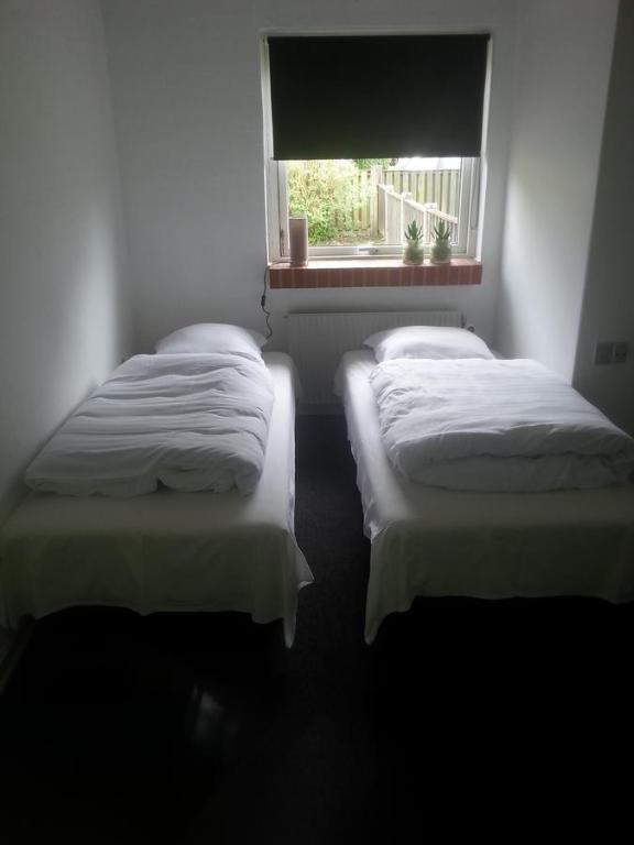 Postel nebo postele na pokoji v ubytování Centrum Sleepover