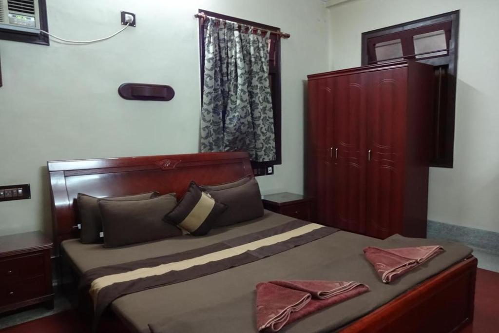 Postel nebo postele na pokoji v ubytování The Kei Suites