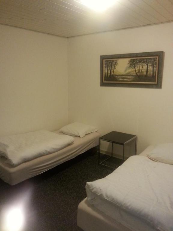 Postel nebo postele na pokoji v ubytování Centrum Sleepover
