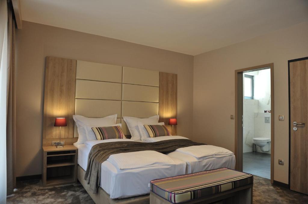 Postel nebo postele na pokoji v ubytování Hotel VIP
