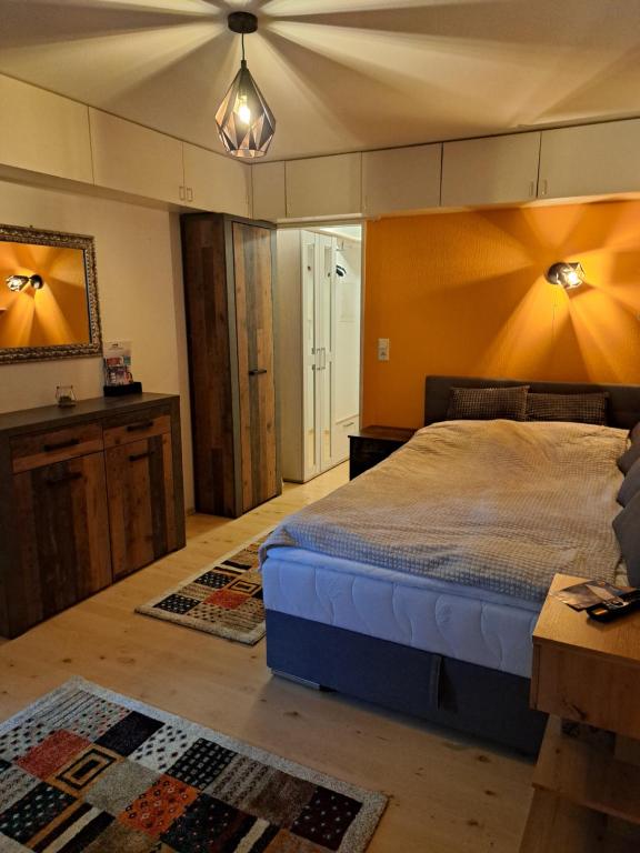 a bedroom with a bed and a ceiling at Ferienwohnung, Monteurwohnung in Scheidegg