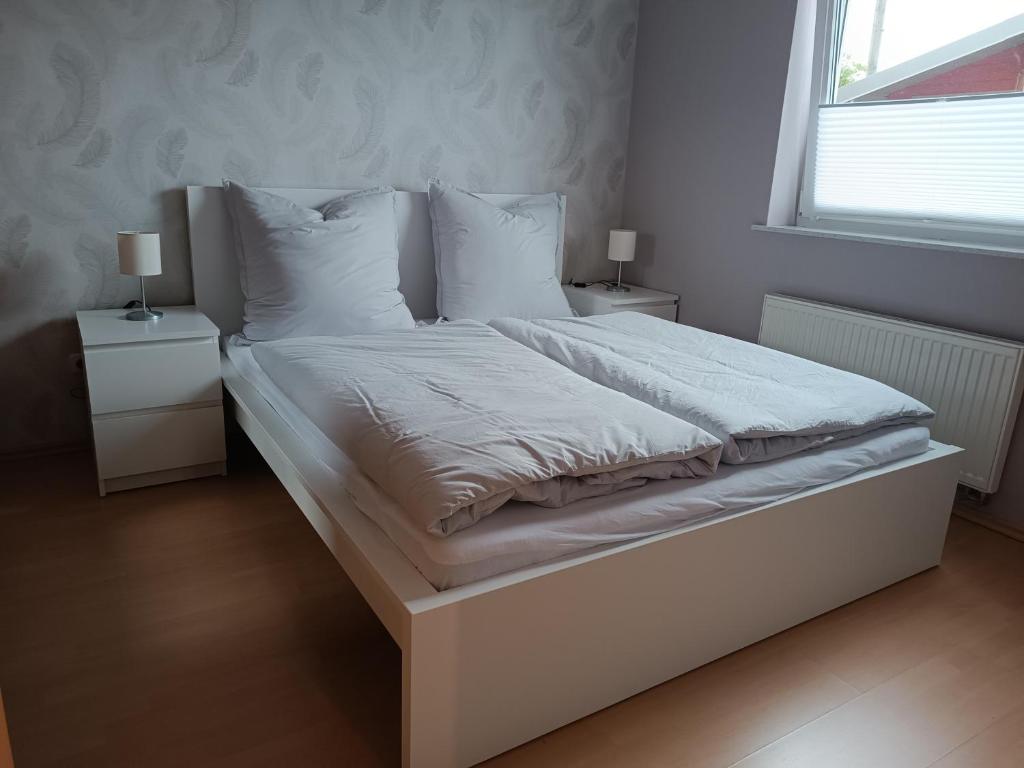 Postel nebo postele na pokoji v ubytování Ferienwohnung Limper