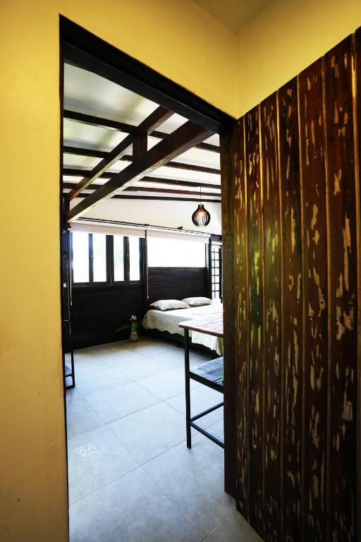 Cama ou camas em um quarto em Pousada Aquarela de Bombinhas