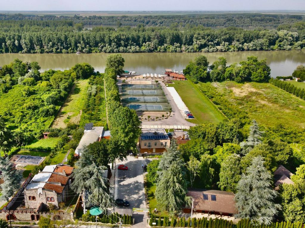 an aerial view of a building next to a river at Hotel Marina OASA in Grocka