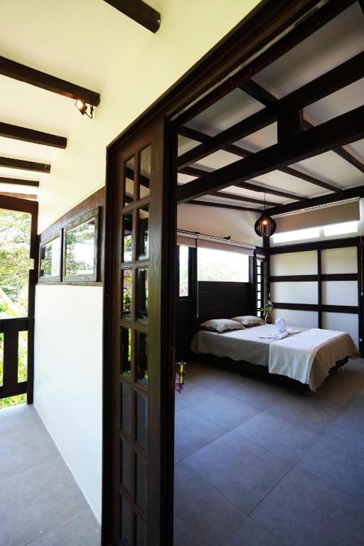 Cama ou camas em um quarto em Pousada Aquarela de Bombinhas