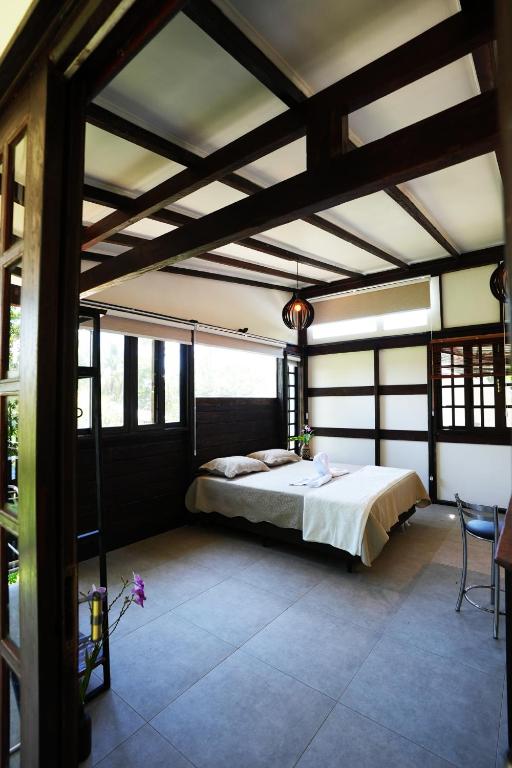 Cama ou camas em um quarto em Pousada Aquarela de Bombinhas