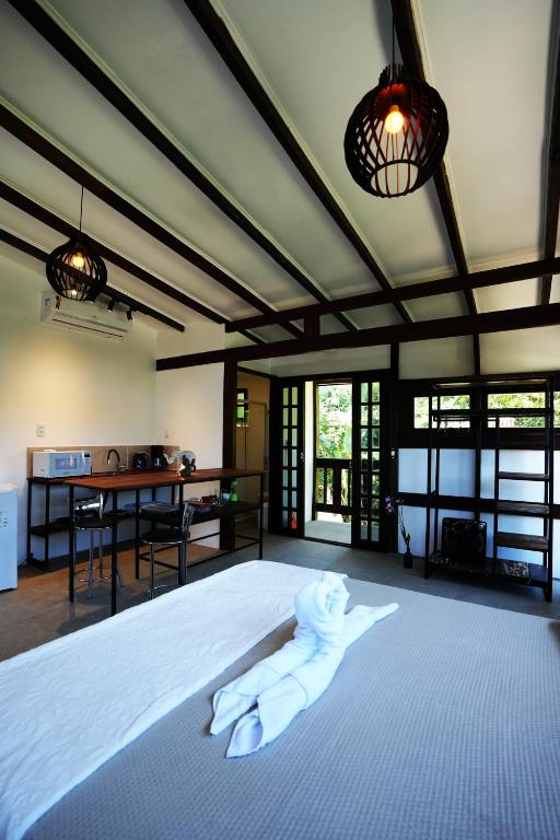 Cama ou camas em um quarto em Pousada Aquarela de Bombinhas