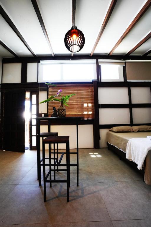 Cama ou camas em um quarto em Pousada Aquarela de Bombinhas