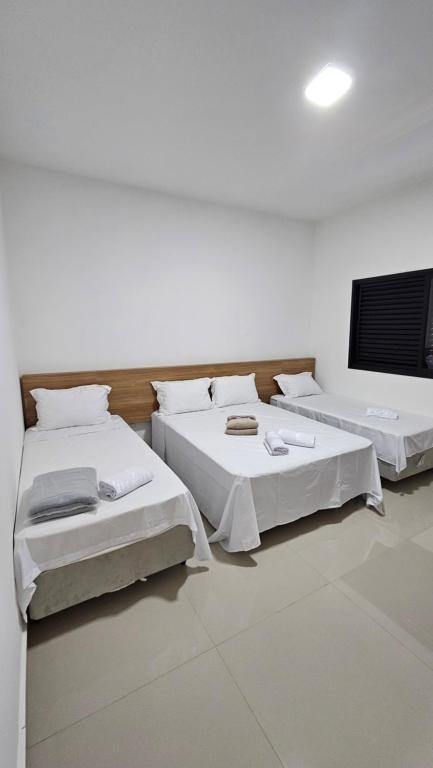 Cama ou camas em um quarto em GARITÃO HOTEL