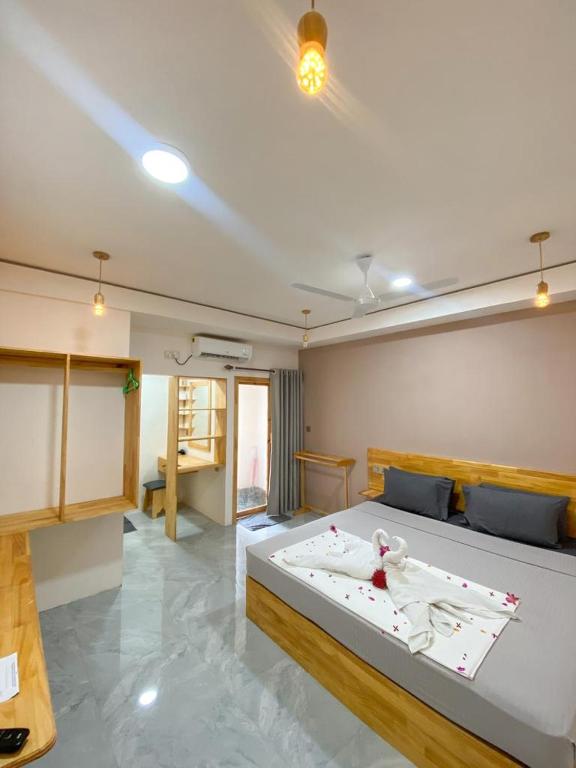 Postel nebo postele na pokoji v ubytování Mahchavaru Maldives