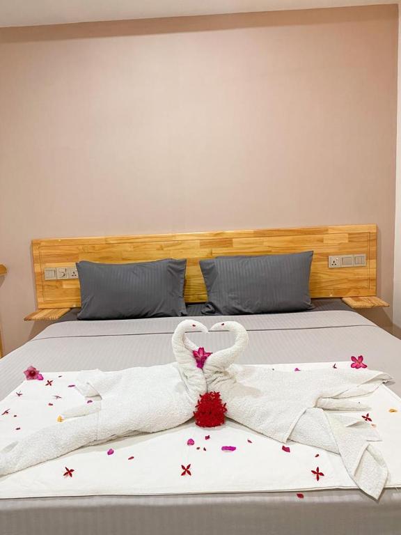 Postel nebo postele na pokoji v ubytování Mahchavaru Maldives