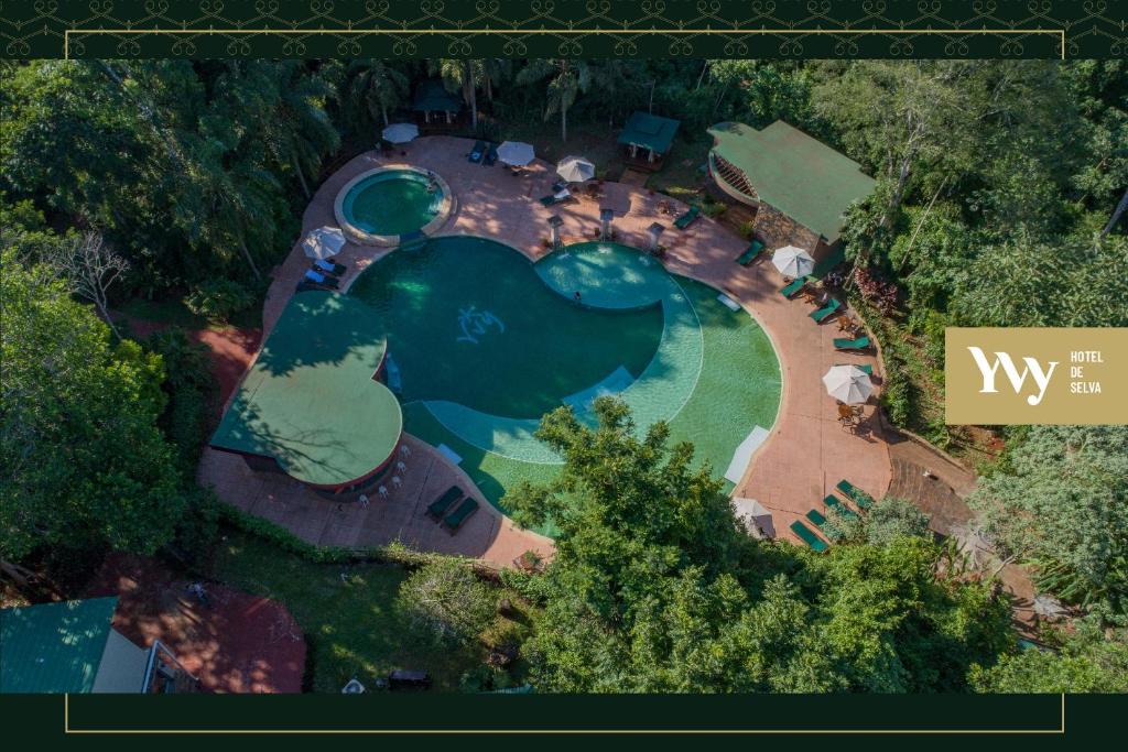 an overhead view of a swimming pool with a resort at Yvy Hotel de Selva in Puerto Iguazú