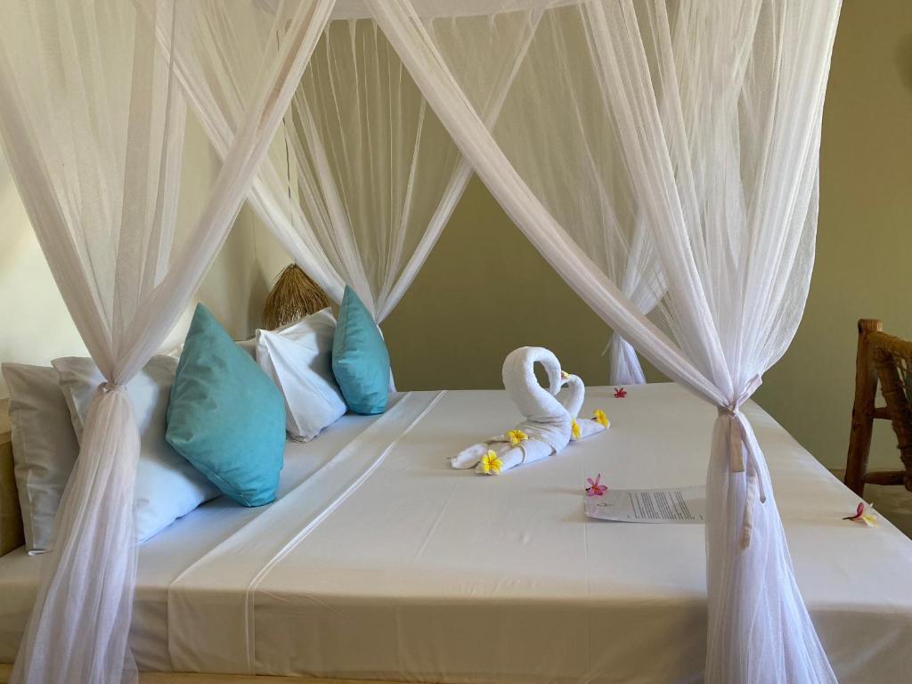 Postel nebo postele na pokoji v ubytování Zen Boutique Resort