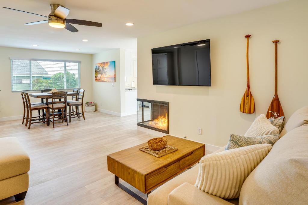 a living room with a couch and a fireplace at Ocean-View Oasis Steps to Dana Point Beaches! in Dana Point