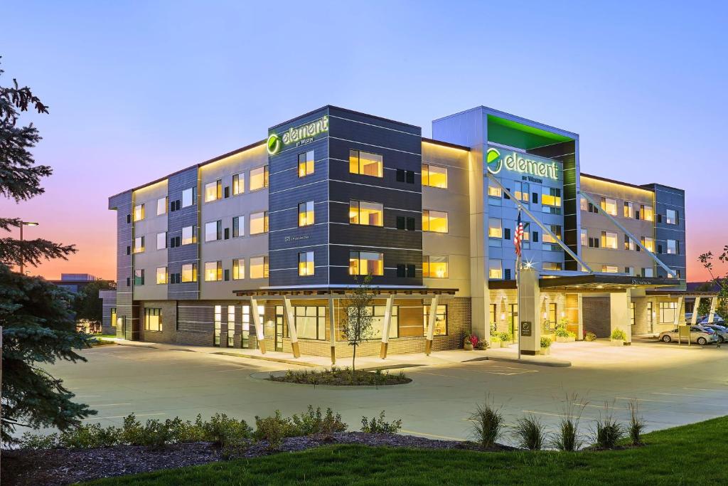 a building with a parking lot in front of it at Element Albuquerque Uptown in Albuquerque