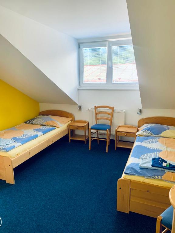 Postel nebo postele na pokoji v ubytování hotel Sádek