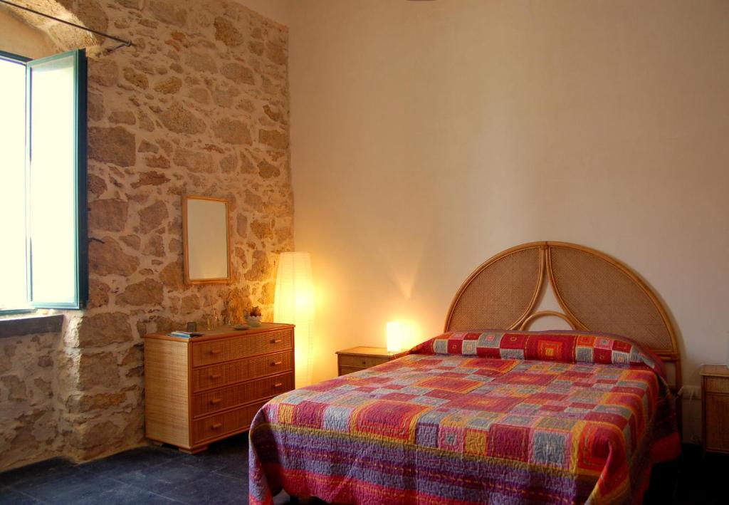 Ένα ή περισσότερα κρεβάτια σε δωμάτιο στο Casa Vacanze Magnolia
