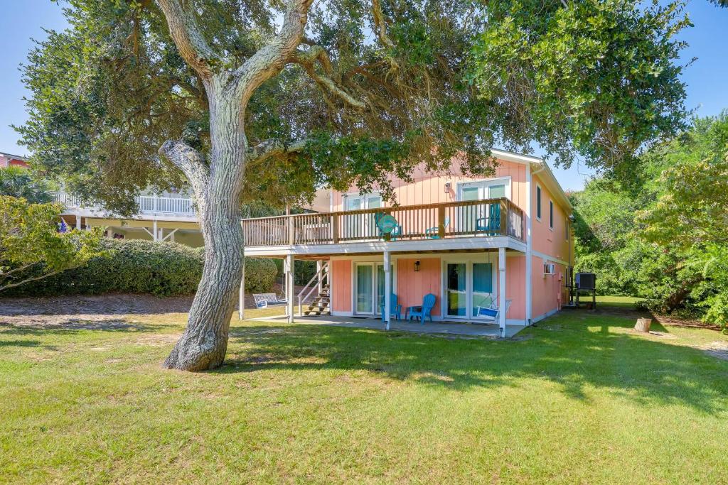 a large house with a tree in the yard at Emerald Isle Vacation Rental, Walk to Beach! in Emerald Isle