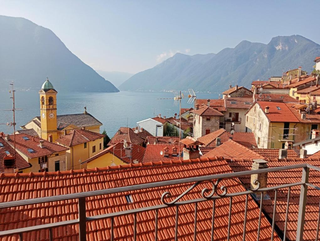 a view of a town with a view of the water at Casa Corinna, Lake View, Terrace, Private Garage! in Colonno