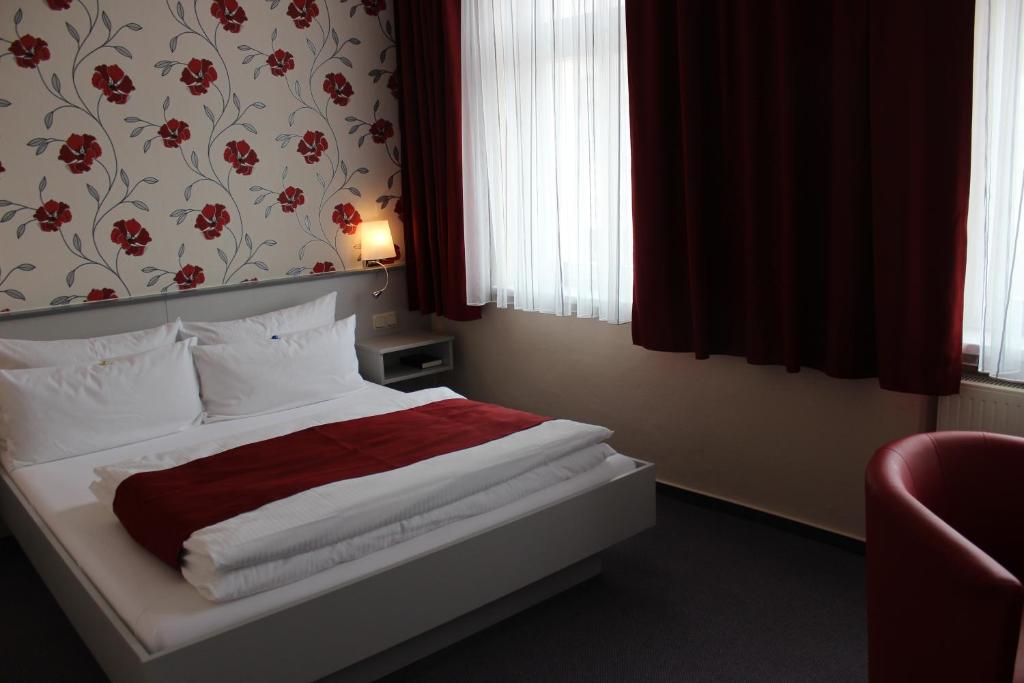 Postel nebo postele na pokoji v ubytování APARTHOTEL 1A