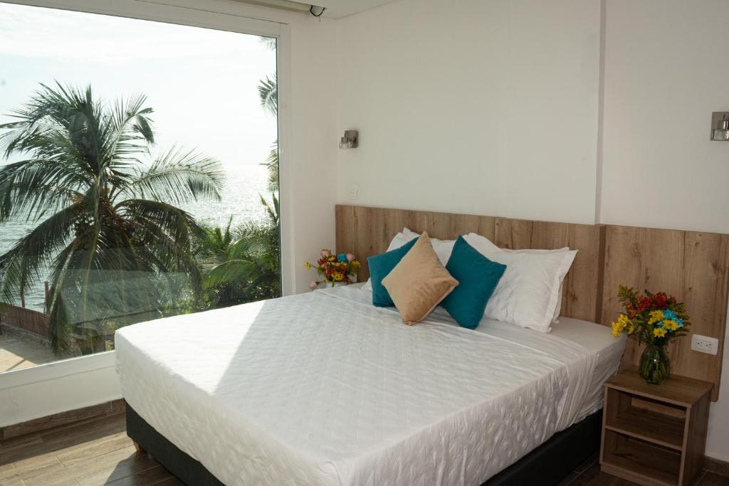 Postel nebo postele na pokoji v ubytování Hotel Caribbean Cartagena