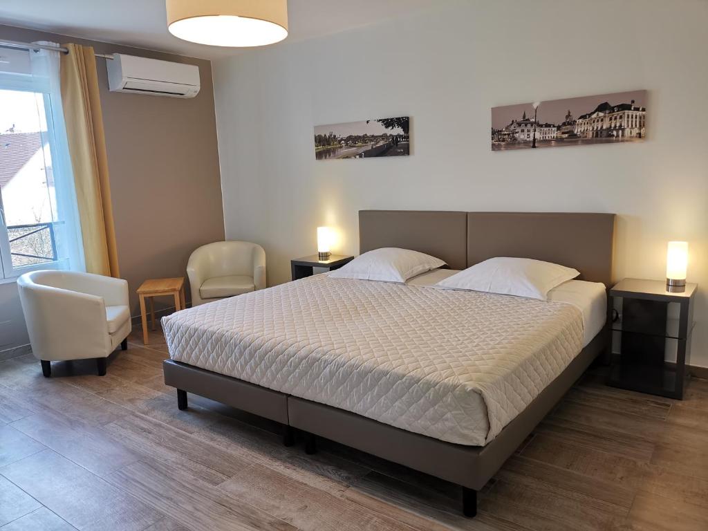 Ένα ή περισσότερα κρεβάτια σε δωμάτιο στο Chambres d'hôtes GIDY
