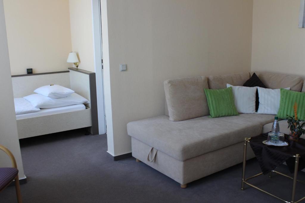 Postel nebo postele na pokoji v ubytování APARTHOTEL 1A