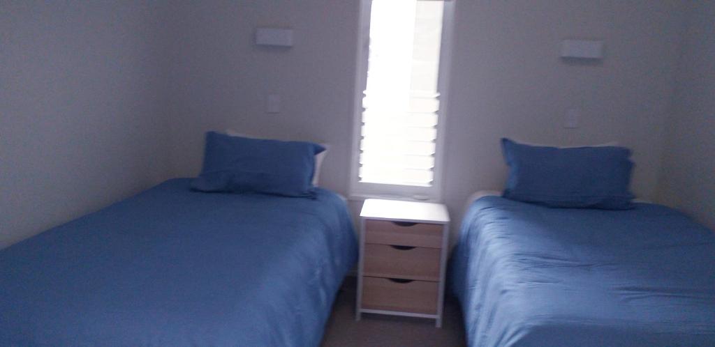 Postel nebo postele na pokoji v ubytování Apartment Twelve