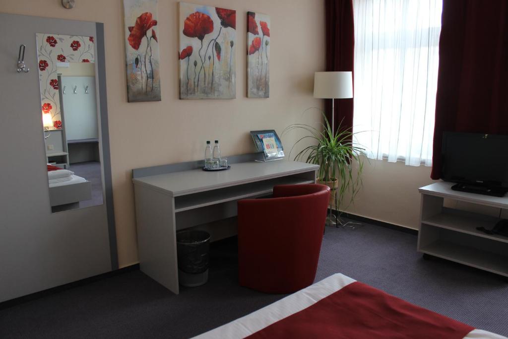 TV a/nebo společenská místnost v ubytování APARTHOTEL 1A