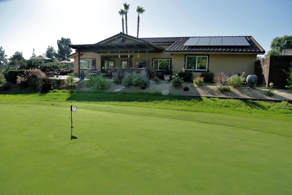 a house with a golf ball on the green at Cottage On The Greens - Studio in Poway