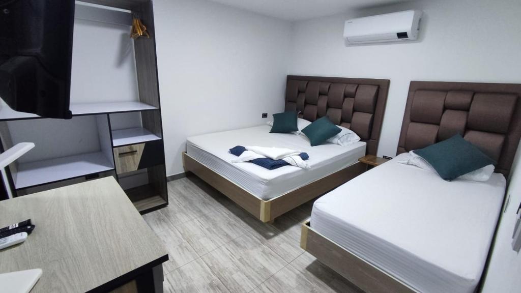 Postel nebo postele na pokoji v ubytování Hostel Boutique Nido de Loros