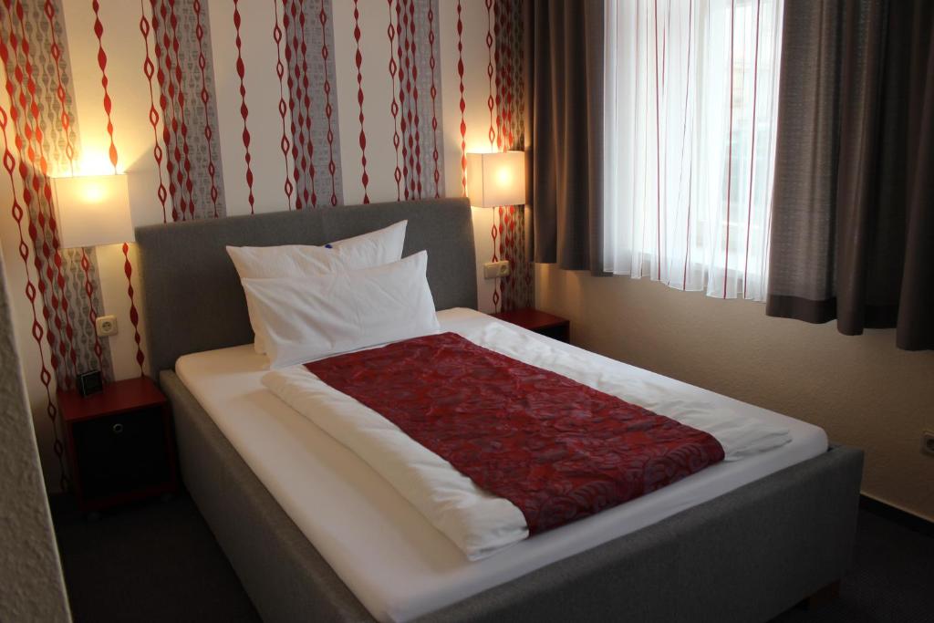 Postel nebo postele na pokoji v ubytování APARTHOTEL 1A