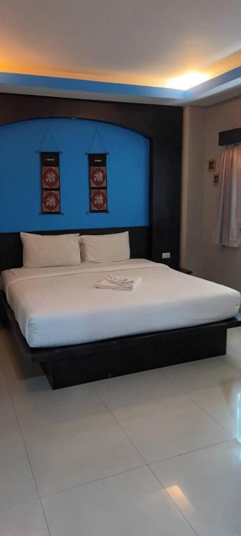 Postel nebo postele na pokoji v ubytování New Lavender Hotel Patong