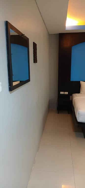 Postel nebo postele na pokoji v ubytování New Lavender Hotel Patong