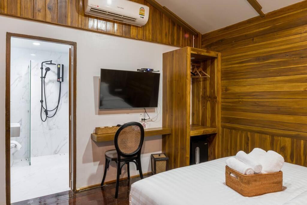 Postel nebo postele na pokoji v ubytování U Villa Chiangkhan (อยู่วิลล่าเชียงคาน)
