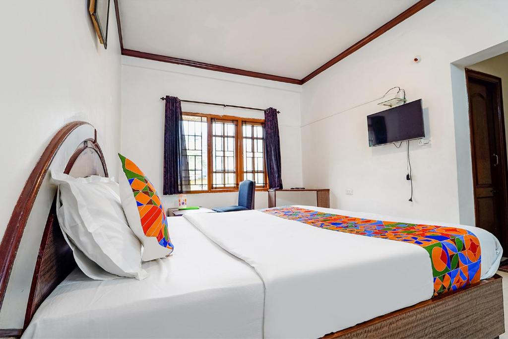 Postel nebo postele na pokoji v ubytování Hotel Orchid Inn