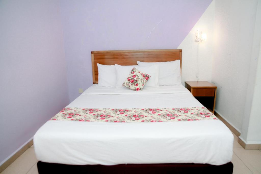 Postel nebo postele na pokoji v ubytování HOTEL D VIEW MERSING
