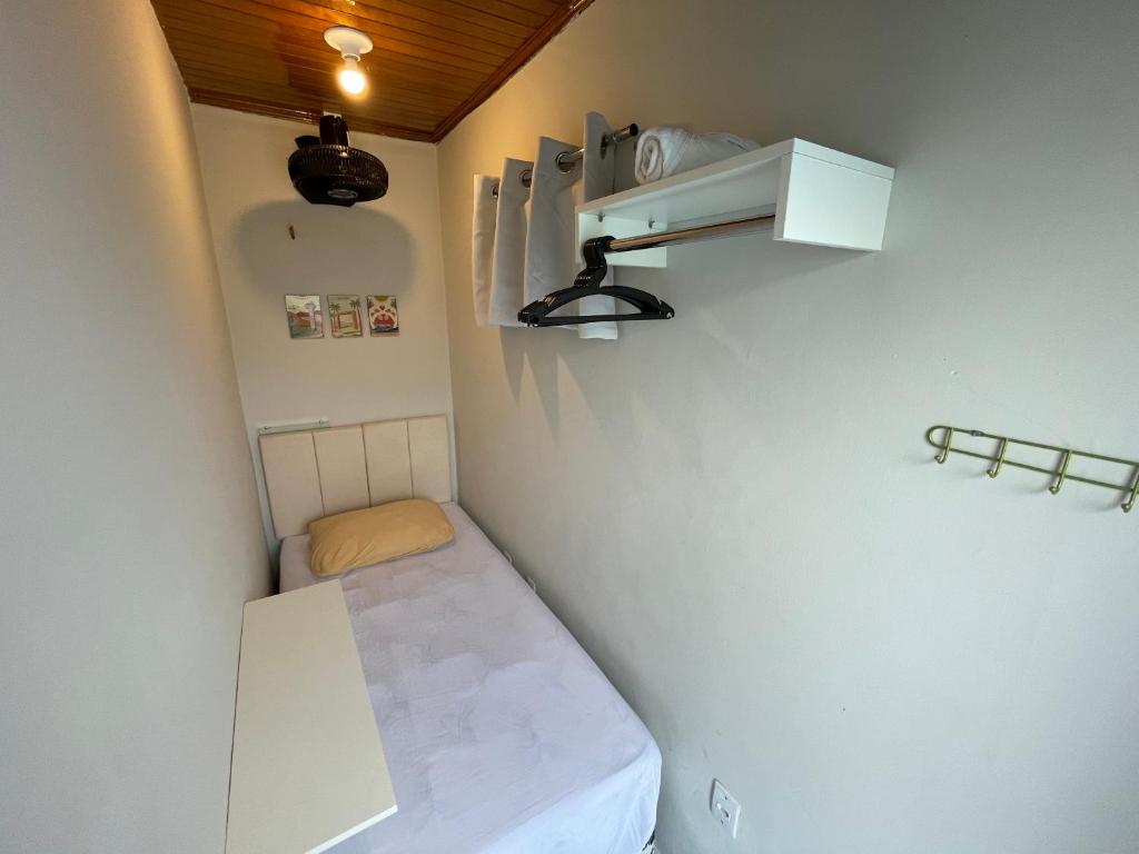 a small room with a small bed in a room at MiniRooms in Boa Vista