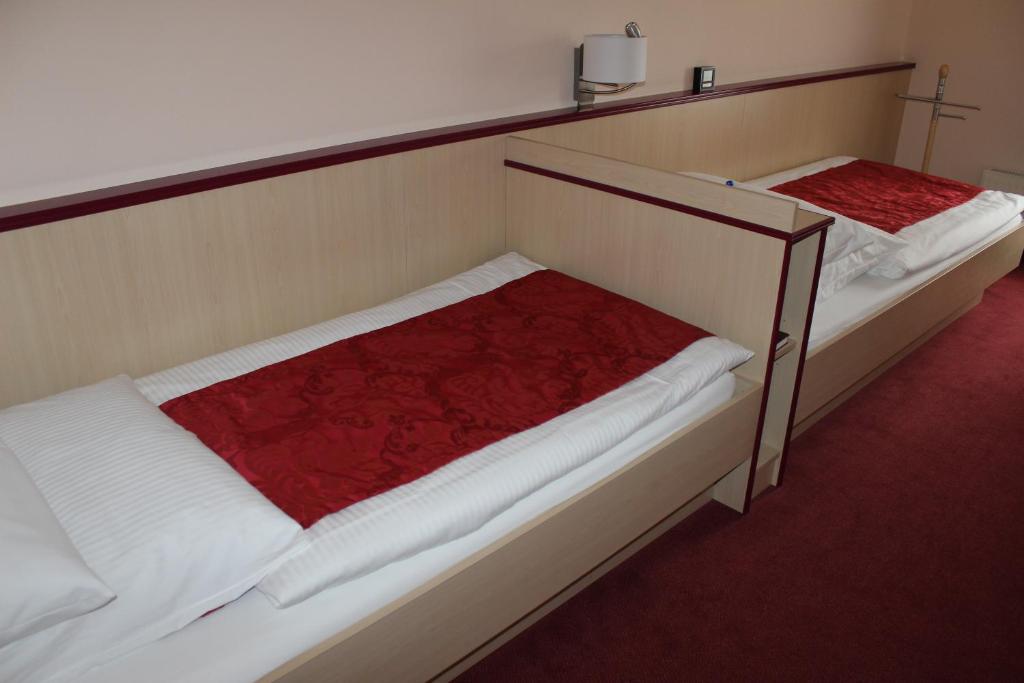 Postel nebo postele na pokoji v ubytování APARTHOTEL 1A